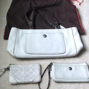 Coach leather bag with 2 mini wristlets.